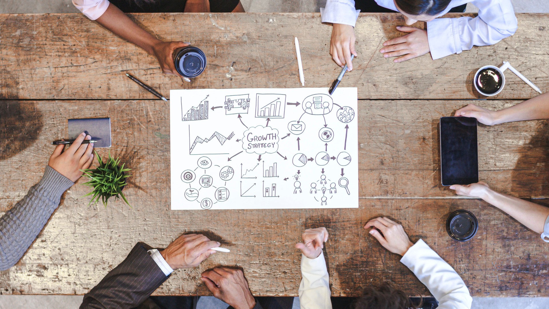High Angle View of Business Development Team in Strategy Meeting